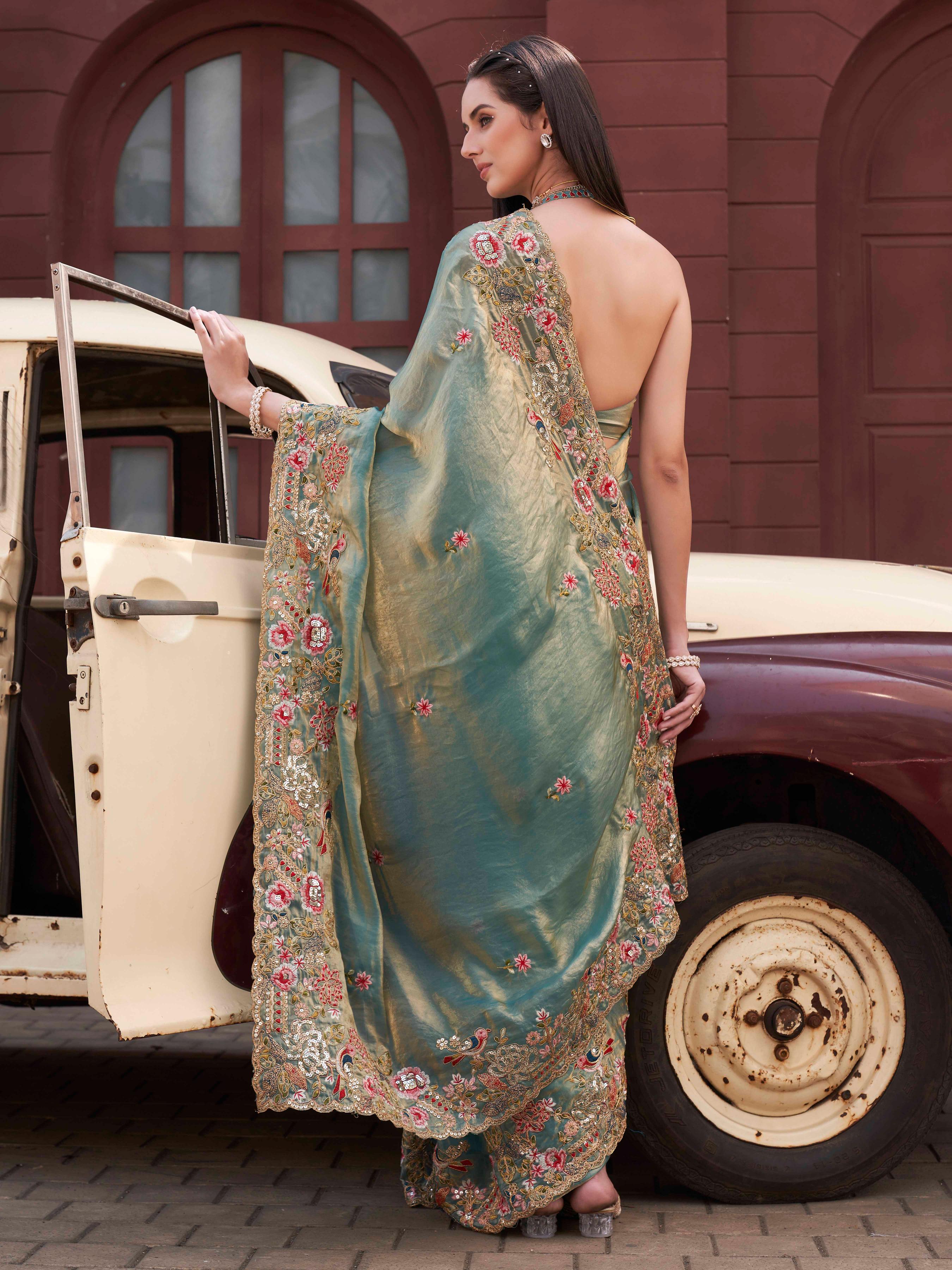 Two tone blue and gold colored jimmy choo saree with sequinned embroidery border